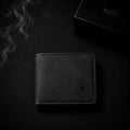 Black bifold wallet with embossed M emblem and MOZ gift box