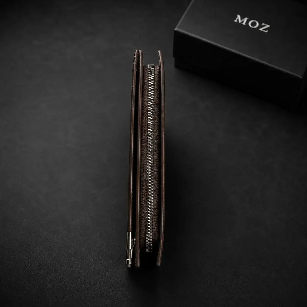Dark brown zip-around wallet showing zipper closure edge